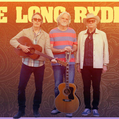 Three people standing with two acoustic guitars in front of a patterned background, text reads “THE LONG RYDERS.